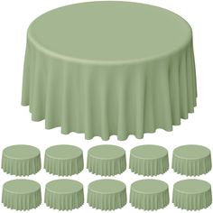 a round table covered in green cloths with eight smaller tables next to the table