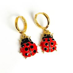 "Bright 3D ladybird earrings with a secure latch back fastening. * 18k gold plated hoops * Enamel & 18k gold plated ladybug charm * Latch back fastening for security * Approximate drop is 1.25\" (30mm) * Hoops measure 0.5\" (12mm) in diameter * Lightweight and easy to wear  * Beautifully packaged with additional gift wrap available at the checkout * Add a gift message and ship direct to the recipient  * A portion of the profit from these ladybird earrings will be donated to the Alzheimer's socie Small Hoop Clip-on Earrings For Gift, Clip-on Huggie Earrings For Gift, Clip-on Huggie Earrings As Gift, Small Hoop Clip-on Huggie Earrings As Gift, Yellow Gold Huggie Clip-on Earrings For Gift, Yellow Gold Hoop Clip-on Earrings For Gift, Yellow Gold Hoop Clip-on Earrings As Gift, Clip-on Small Hoop Huggie Earrings For Gift, Adjustable Clip-on Hoop Earrings As A Gift