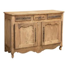 an old wooden sideboard with ornate carvings on the doors and drawers, isolated against a white background