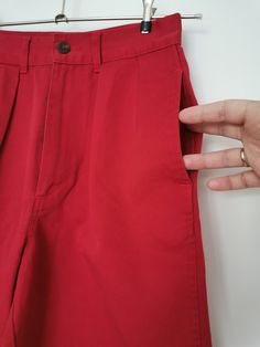 Vintage Polo Chino shorts by Ralph Lauren from the 1980's. Women's high waist preppy shorts in brick red. Pleated front, two front pockets and two back pockets. Zipper fly closure. Material: 100% Cotton Size: Marked T10. Fit like women's XXS. To be sure this item would fit you, please look at the measurements below. Approximate Measurements (taken with shorts lying flat, double waist and hips ) Waist (double that): 11.4 inches / 29 cm Hips (double that) : 18.9 inches / 48 cm Overall Length: 17.2 Retro Wide Leg Cotton Shorts, Red Bottoms With Belt Loops And Short Length, Red Shorts With Belt Loops, Retro Red Cotton Bottoms, Vintage Short Cotton Pants, Vintage Cotton Short Pants, Red Short Cotton Pants, Vintage Red High Waist Bottoms, High Waist Red Cotton Shorts