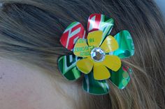 a close up of a woman's head with a flower in her hair that says do you have time to hit?