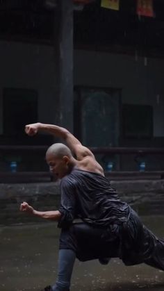 a man in black shirt doing a trick on skateboard