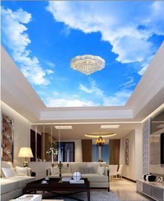 a living room filled with furniture and a sky mural on the wall above it's ceiling