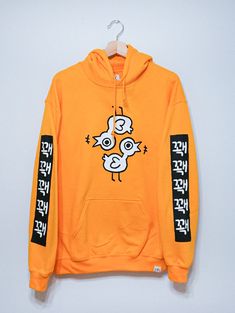 QUACK QUACK HOODIE Text on sleeve says "quack quack quack quack " in Korean. AVAILABLE SIZES SMALL MEDIUM LARGE X-LARGE 2XL CARE INSTRUCTIONS Washing the hoodie inside out in cold water is recommended for longer lasting color :)* original ohmonah design - WINTER 2019 * Silly Clothes, Fun Clothing, Quack Quack, Big Sweaters, Cute Sweaters, Cool Shirts, Style Me