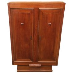 an old wooden armoire with two doors