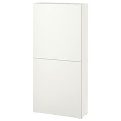 a white refrigerator freezer sitting on top of a white floor next to a wall