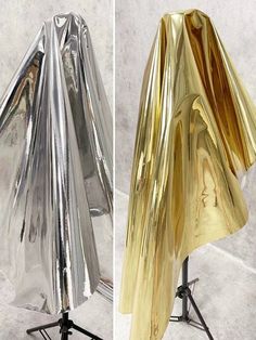 two different views of a gold and silver umbrella