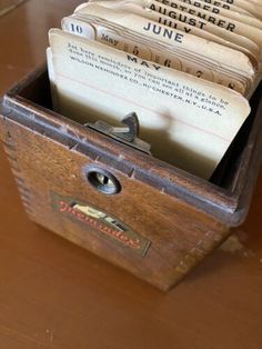 a wooden box filled with lots of mail