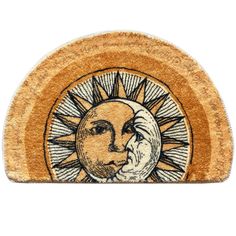 a door mat with the sun and moon on it's face in black ink