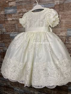 Celebrate special moments with our beautiful christening-inspired girl's dress. Crafted in pure white and embellished with delicate details, this dress is the perfect choice for such a significant occasion. It is a beautiful dress for any special occasion, it is made in any color of your preference, they are personalized. All our dresses are very well made and have good quality materials. *Underneath the main fabric there are two layers of tulle to give volume to the dress. *Soft, comfortable an Elegant Short Sleeve Pageant Gown, Elegant Short Sleeve Princess Dress For Confirmation, Elegant First Communion Dress With Short Sleeves For Pageants, Elegant Short Sleeve Princess Dress For First Communion, Elegant Cream Baptism Dress For First Communion, White Short Sleeve First Communion Dress For Pageant, Elegant First Communion Dress With Pearl Embroidery, Elegant Princess Dress With Pearl Embroidery For Baptism, Cream Princess Dress For First Communion