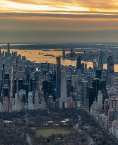 an aerial view of new york city at sunset