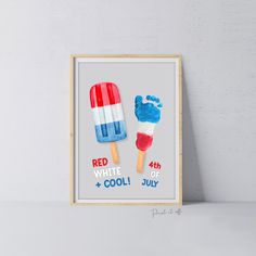 a red, white and blue popsicle art print is displayed on a shelf next to a wall