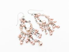 Fun vintage pink faux pearl earrings with sterling silver earwires. Excellent condition. Stamped 925. US SHIPPING: US orders over $35 ship free via first class mail. Orders over $200 receive a free priority mail upgrade. Upgrade to priority mail for $5 on small items. Express shipping is also available. SHIPPING OUTSIDE THE US:  We combine shipping on multiple item orders.  Expedited shipping and insurance are available for an additional fee. GIFTS:  Request complimentary gift messages & gift bo Vintage Sterling Silver Jewelry, Pearl Chandelier, Types Of Gifts, Faux Pearl Earrings, Gold And Silver Rings, Etsy Earrings Dangle, Vintage Sterling Silver, Vintage Pink, Priority Mail