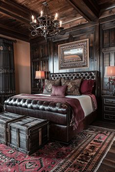 a large bed sitting in a bedroom under a chandelier