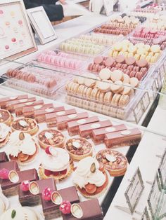 an assortment of desserts and pastries on display