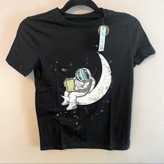 New With Tags Cat & Jack Astronaut Sitting On A Moon Reading A Book Graphic Glow In The Dark Medium 8/10 Black Cotton Space-themed T-shirt, Black Space-themed T-shirt With Letter Print, Black Cotton T-shirt With Space Theme, Black Short Sleeve Space-themed Tops, Dinosaur Tee, Book Graphic, Moon Reading, Jack Green, Peplum Shirts