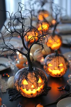 a table topped with lots of pumpkins on top of tables covered in candlesticks