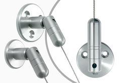 an image of two metal objects attached to the side of a wall mounted light fixture