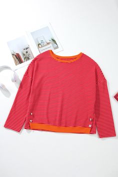 Expertly crafted from high-quality materials, this Tomato Red Two Tone Striped Top features drop shoulder sleeves and side buttons for a touch of elegance. The two-tone striped design adds a modern, stylish twist, making it a versatile piece for any wardrobe. Stay comfortable and fashionable with this must-have top. Size Chart (INCH) Sizes US Sizes Euro Sizes UK Sizes Bust Hem_Width Shoulder Sleeve_Length Length Relax Relax Relax Relax Relax S 4-6 34-36 8-10 44.5 44.9 29.3 16.3 24.4 M 8-10 38-40 Red Trendy Tops With Buttons, Trendy Red Tops With Buttons, Trendy Red Buttoned Tops, Red Crew Neck Top With Buttons, Drop Shoulder Top, Vest Crop Top, Romper And Jacket, Cardigan Top, Loose Tops