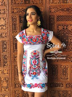 This Beautiful Mexican Colorful Floral Dress is the perfect dress for a fun night out or a special event. It is full of colorful embroidered flowers and has some crocheted details. This dress has ties on the back in order to adjust the fit. Please note: The accesories shown with this dress may purchased as well and Can be found in this links https://www.etsy.com/es/listing/637147293/filigrana-redonda-filigrana-clasica?ref=shop_home_active_1&pro=1&frs=1 https://www.etsy.com/es/listing/819 Multicolor Fitted Cotton Embroidered Dress, Fiesta Embroidered Cotton Dress With Multicolor Embroidery, Multicolor Embroidered Cotton Dress For Fiesta, Multicolor Floral Embroidered Short Sleeve Dress, Multicolor Embroidered Dress For Spring Fiesta, Fitted Multicolor Embroidered Floral Dress, Spring Multicolor Embroidered Dress With Neckline Detail, Fiesta Cotton Embroidered Dress With Short Sleeves, Multicolor Embroidered Dress For Fiesta