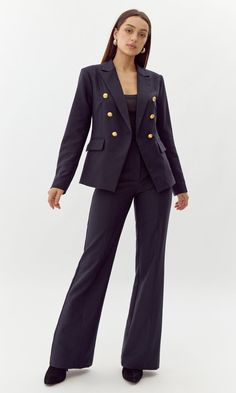 This bold blazer is adorned with gold buttons on the bodice and sleeves. The double-breasted structure also features faux, front pockets and a notched lapel. Can be matched with Colson Trousers. Blazer Double-Breasted Lined Length: 26" Chest: 17 1/4" Self: 77% Polyester, 16% Viscose, 7% Spandex Lining: 97% Polyester, 3% Spandex Hand wash in cold water with similar colors. Model is wearing a size small Style #: G247J1755 Business Casual Long Sleeve Double-breasted Pantsuit, Double-breasted Office Wear Pantsuit With Double Button Closure, Double-breasted Business Casual Fall Pantsuit, Fall Double-breasted Business Casual Pantsuit, Office Pantsuit With Double Button Closure For Fall, Chic Double-breasted Career Suit, Office Blazer Dress With Double-breasted Button Fastening, Double Button Long Sleeve Office Pantsuit, Office Blazer Dress With Double-breasted Buttons