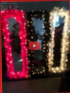 two mirrors with lights on them and one is decorated in red, white and pink