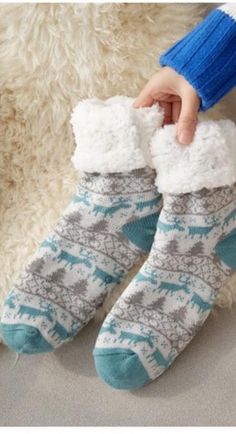 Walking in the Winter Wonderland or even just on your cold floors in the winter; these knitted slipper socks will keep your feet nice and cozy on those cold winter days and nights. Featuring a with faux fur lining and a rubber sole design on the bottom to prevent slipping when walking these are sure to be a new favorite part of your lounge wear. Made with a polyester and cotton blend. Comes in 21 fun patterns from which to choose. Warm Cozy Socks For Stocking Stuffer, Cozy Warm Socks For Stocking Stuffers, Warm Comfortable Socks, Casual Indoor Socks For Winter, Soft Indoor Socks For Winter, Comfortable Winter Slippers For Home, Cozy Non-slip Socks For Indoor Use, Snug Non-slip Winter Socks, Cozy Non-slip Indoor Socks