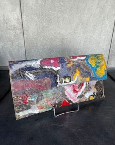 This clutch bag has been hand crafted from Italian leather and hand painted with an abstract design, turning this work of art into a chic accessory. It is a truly unique, one of a kind piece. The colors are simply gorgeous, forming a beautifyl design. Measurments: 38 cm .width x 20 cm. height                            15 in. width x 8 in. height It has a shoulder chain which is removable. Multicolor Leather Rectangular Clutch, Multicolor Rectangular Leather Clutch, Luxury Multicolor Pouch Clutch, Boho Style Bag, Hand Painted Leather, Shoulder Chain, Painting Leather, Chic Accessories, Boho Stil