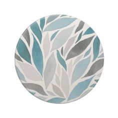 a blue and gray plate with leaves on it