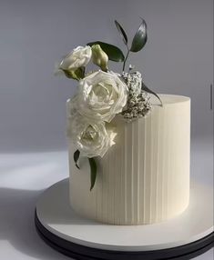 there is a white cake with flowers on it