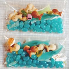 two bags filled with blue and green candies