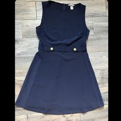 All Orders Ship In 1-4 Business Days! Navy Blue Business Dress Buttons Conditions: New Condition/Clean Condition/No Holes/No Stains/No Pilling/No Fade The Color Is Navy Size L Perfect Business Professional Dress Stretch Material Smoke Free Home! Blue Sleeveless H&m Dresses, H&m Blue Sleeveless Dress, Fitted Blue H&m Dress, H&m Blue Mini Length Dresses, H&m A-line Dresses, H&m Blue Mini Dress, Fitted H&m Dresses With Buttons, H&m Mini Dress For Work, Chic Blue H&m Dress