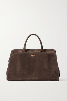 EXCLUSIVE AT NET-A-PORTER. Métier's 'Private Eye' tote might just be named for its subtlety. Generously sized to fit all your daily essentials, this large iteration is crafted from suede in an elegant top-handle shape that can be carried by a detachable strap, too. The pull-out pouch can be converted into a cross-body bag - ideal for after-work events.