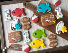 decorated cookies are displayed on a tray with the names of their favorite children's books