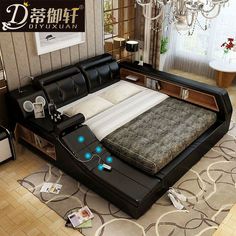 a bed that is in the middle of a room with lights on top of it