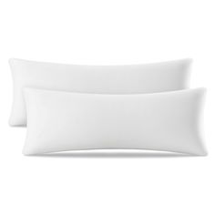 two white pillows sitting next to each other