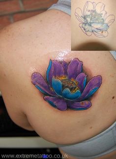 a woman's stomach with a flower tattoo on the side and an image of a lotus