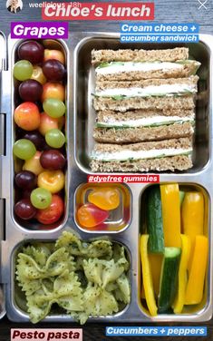 a lunch box filled with different types of food and veggies on top of it