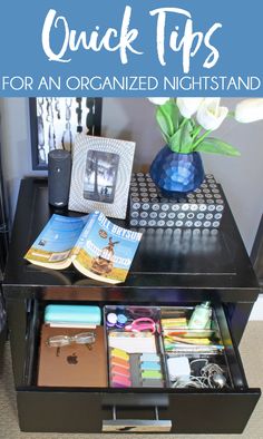 an organized night stand with books, magazines and other items on it that are sitting on top of a black table