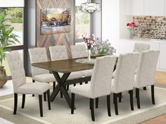 a dining room table with six chairs and a potted plant on the rug in front of it