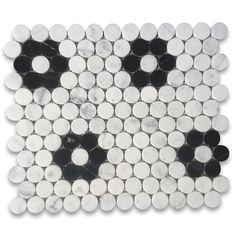 a white and black tile with circles on it