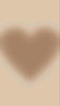 a heart shaped shadow on a beige background