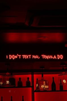 a neon sign that reads, i don't text you, tequila did