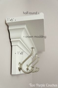 an image of a white shelf with hooks and brackets on it's sides, labeled