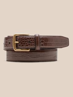 Sleek and streamlined, this embossed leather belt adds a bit of variety to your wardrobe.  LEATHER WORKING GROUP: By purchasing this product, you are supporting responsible leather manufacturing through the Leather Working Group.  Width: 1" (2. 5cm) Luxury Business Belt With Crocodile Pattern, Luxury Crocodile Pattern Belt For Business, Elegant Leather Belt With Crocodile Pattern, Elegant Formal Belt Buckles With Crocodile Pattern, Elegant Formal Belt Buckle With Crocodile Pattern, Luxury Leather Belt With Crocodile Pattern, Classic Business Belt With Crocodile Pattern, Classic Crocodile Pattern Belts For Business, Brown Leather Belt Buckles For Office