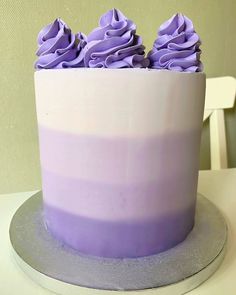 there is a cake with purple frosting on it