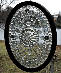 a circular glass window with lots of bubbles on it