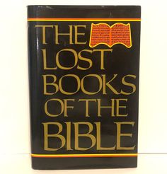 the lost books of the bible written in gold and black on a black book cover