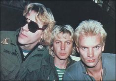 three men with blonde hair and sunglasses posing for the camera