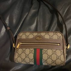 100% Authentic Gucci Ophidia Mini Crossbody In Excellent Condition! No Stains, Rips, Or Anything Like That. I’ve Used It A Handful Of Times So I’m Selling It In Hopes Someone Else Could Get Some Good Use Out Of It! Purchased Directly From Fashionphile. Comes With Fashionphile Dust Bag And Original Dust Bag If I’m Able To Find It! Gucci Ophidia Crossbody, Gucci Ophidia Crossbody Bag, Gucci Bum Bag, Gucci Mini Bag, Gucci Vintage Bag, Pre-owned Gucci Leather Shoulder Bag, Brown Gucci Shoulder Bag With Turn-lock Closure, Gucci Brown Shoulder Bag With Silver-tone Hardware, Gucci Crossbody Bag